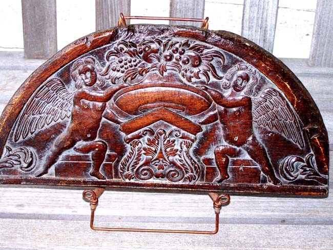 A Reproduction of a late 17th or early 18th century English carved oak panel